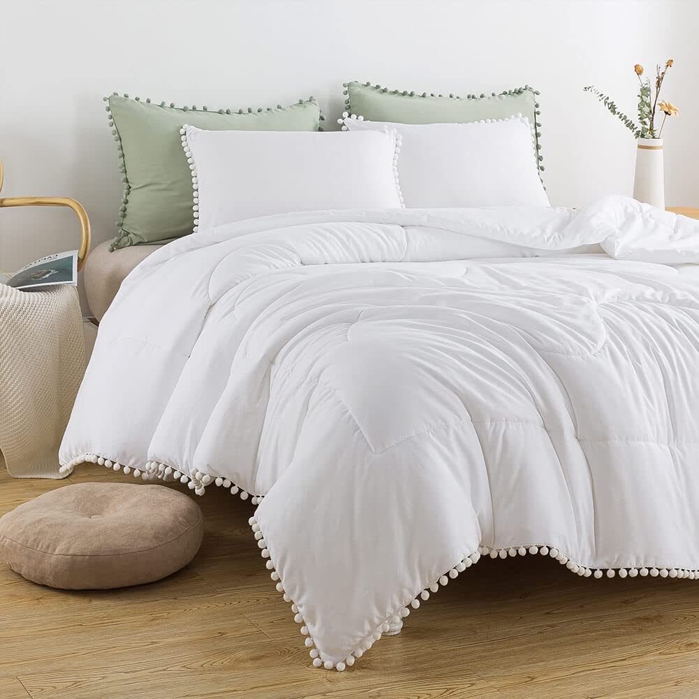 white comforters with pom poms